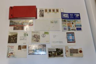 A box containing stamps and First Day covers