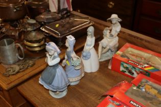 Two Lladro figurines and two similar