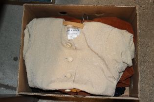 A box containing three women's jackets to include