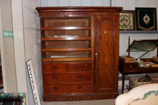 A Victorian mahogany triple wardrobe, interior fit