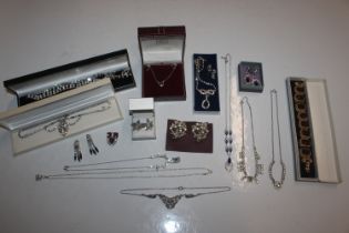 A box of various paste set jewellery