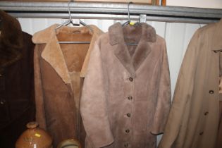 A man's sheepskin coat; and a ladies sheepskin coa