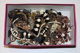 A box containing various Eastern style jewellery,