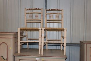 A pair of late 19th / early 20th Century painted and decorated chairs