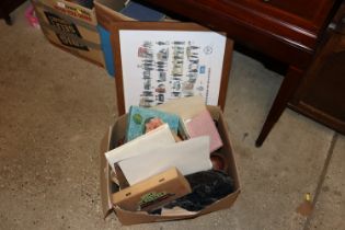 A box containing various albums; vintage envelopes