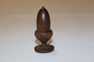 A treen thimble holder in the form of an acorn