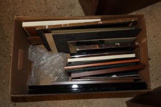 A box of various picture frames, prints etc.