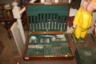 A walnut cased silver cutlery canteen for six pers