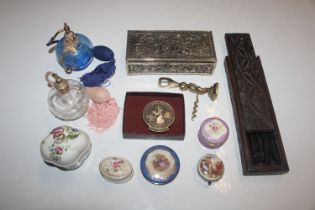 A box containing porcelain trinket boxes, perfume