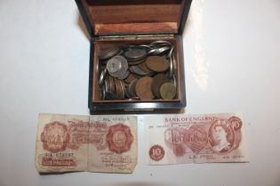 A wooden box and contents of various coinage and b