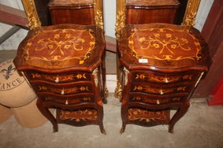 A pair of inlaid bedside tables fitted three drawe