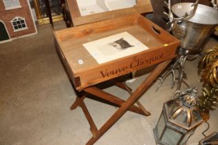 A wooden Champagne tray table