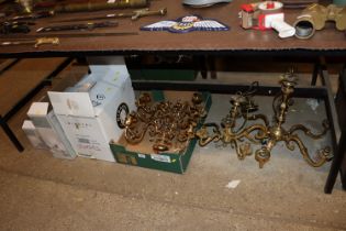 A quantity of brass light fittings and shades