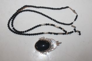 A vintage sterling silver black onyx and lapis laz