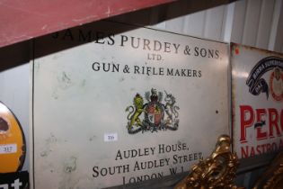 A reproduction tin Purdy & Sons advertising sign