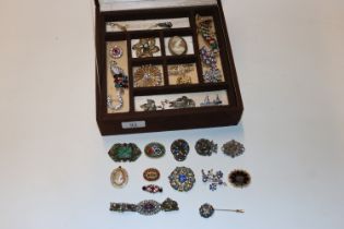 A box containing micro mosaic brooches, cameo broo