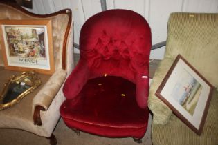 A red Dralon upholstered armchair