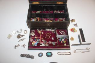 A jewellery box and contents to include various costum