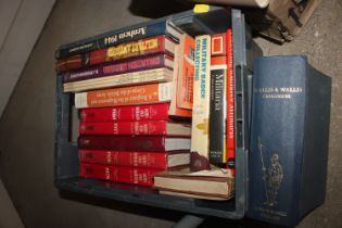 A crate of military books relating to badges and c