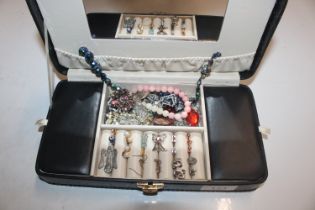 A black jewellery box and contents of various cost