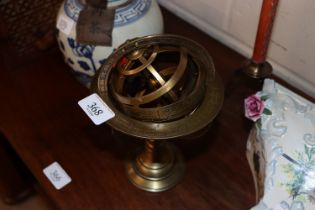 A small brass decorative sundial on stand