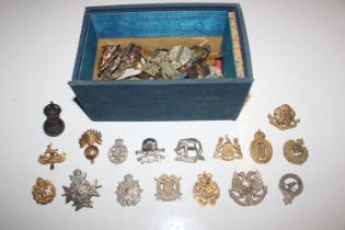 A box containing approx. 100 military hat badges v