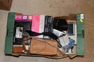 A box of various digital cameras; TomTom satnav et