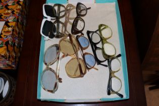 A box containing various vintage glasses