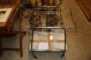 A brass and glass two tier tea trolley