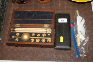 A Sikes hydrometer cased; and a cased drawing inst