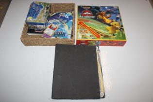 A box containing various Pokémon trading cards etc.