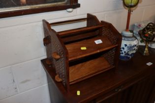 A pair of carved wooden spice racks