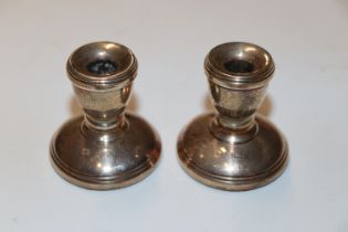 A pair of squat silver candlesticks, Birmingham 19