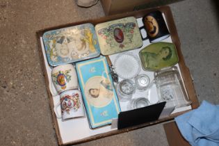 A box of various commemorative items