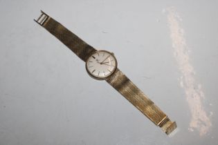 A 14ct gold Omega 601 wrist watch with 9ct gold st