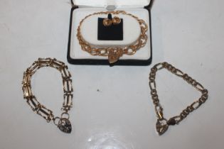 Three gold plated bracelets with padlock clasps an