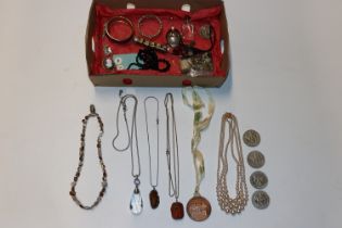 A box containing various costume jewellery includi