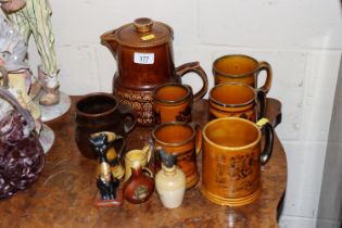 An Arthur Wood tea pot and various tankards