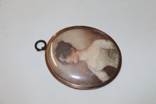 A miniature portrait contained in yellow metal fra