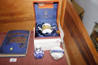 A boxed Charlotte Devita miniature teapot and mug,
