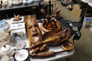 A quantity of various ethnic carved wooden items