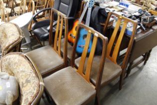 Four teak Nathan style dining chairs