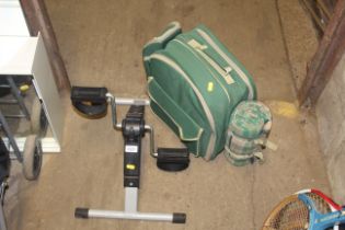 A small pedal exerciser and a picnic backpack