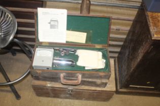 Two wooden crate containing a Velometer and a tool