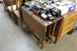 An oak drop leaf dining table