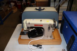 A Sabre Deluxe sewing machine, sold as collectors