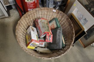 A circular wicker basket and contents of various b