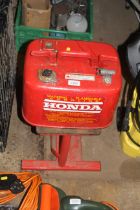 A metal Honda gasoline fuel tank for boats and a w