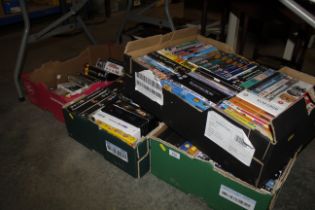 Four boxes containing DVDs