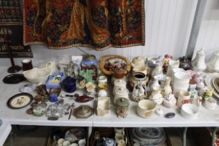A large quantity of various china ornaments, vases